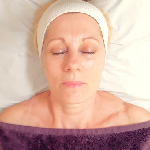Lady having Ayurvedic facial massage